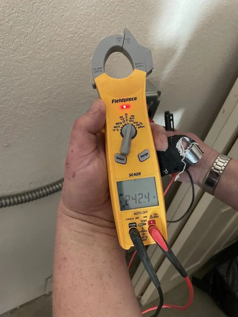 Voltage testing with clamp meter during Circuit Breaker Repair in Tolland